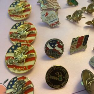 National wild turkey Foundation Pin Collection with Gold and Red Accents.